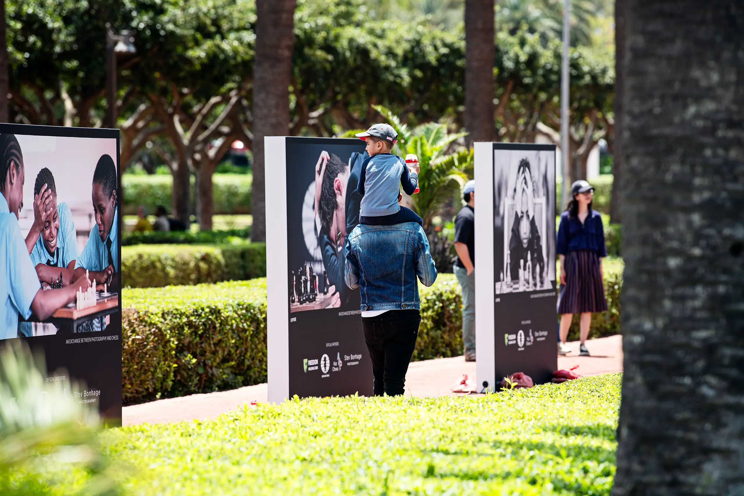 Freestanding double-sided outdoor light frames with chess photographs by Stev Bonhage